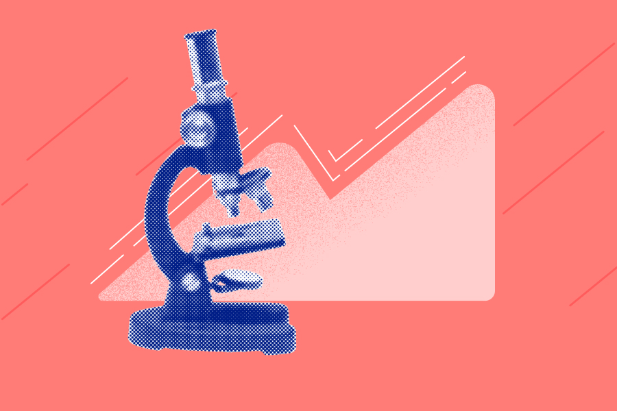 A microscope on a coral background